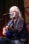 File Photo: Arlo Guthrie performs at Farm Aid, circa 2009, . Used with Permission. All images Copyrighted. (Photo Credit: Larry Philpot)